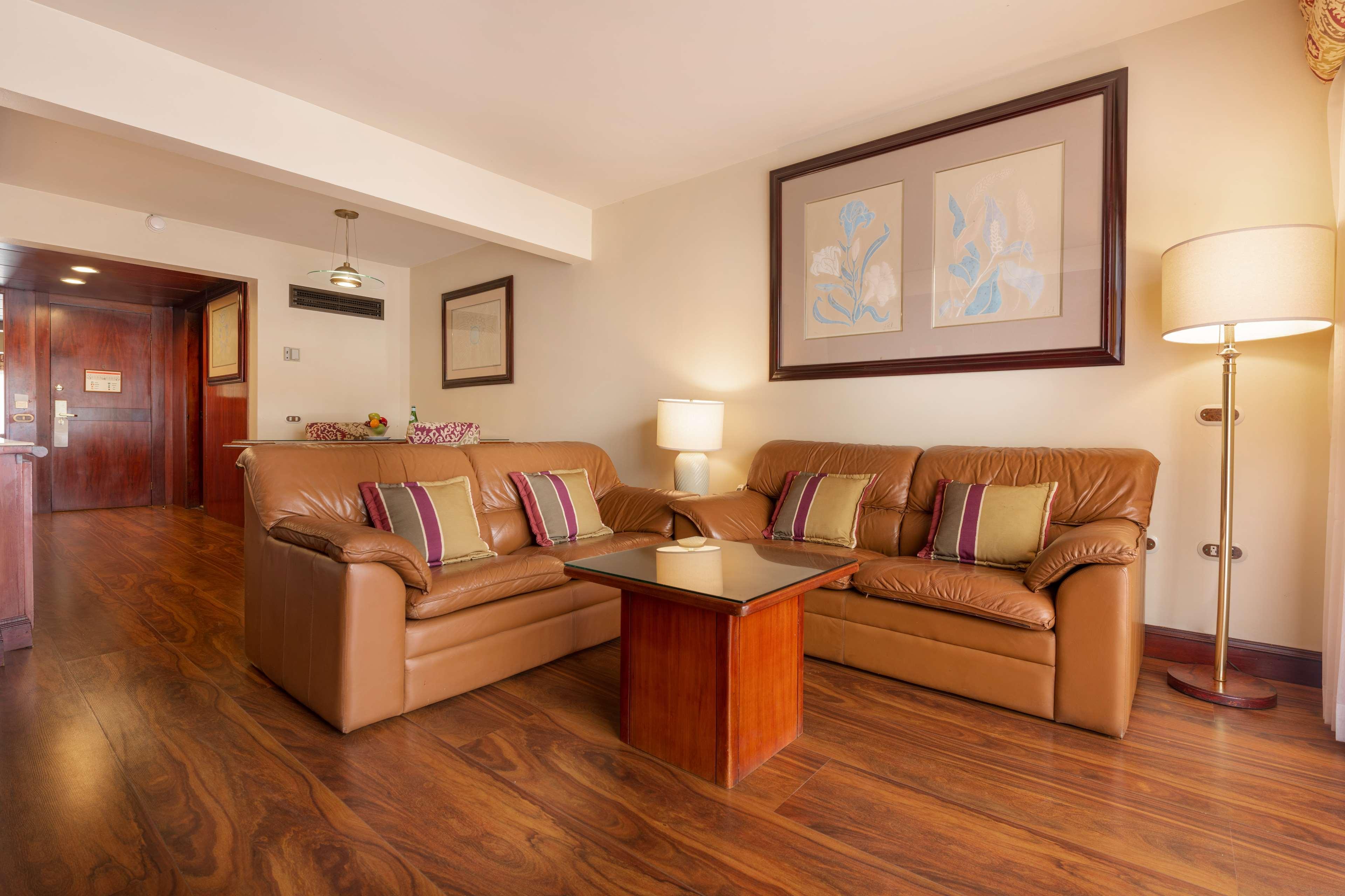 Barcelo San Jose Hotel Exterior photo A living room in a suite at the Hilton London Heathrow
