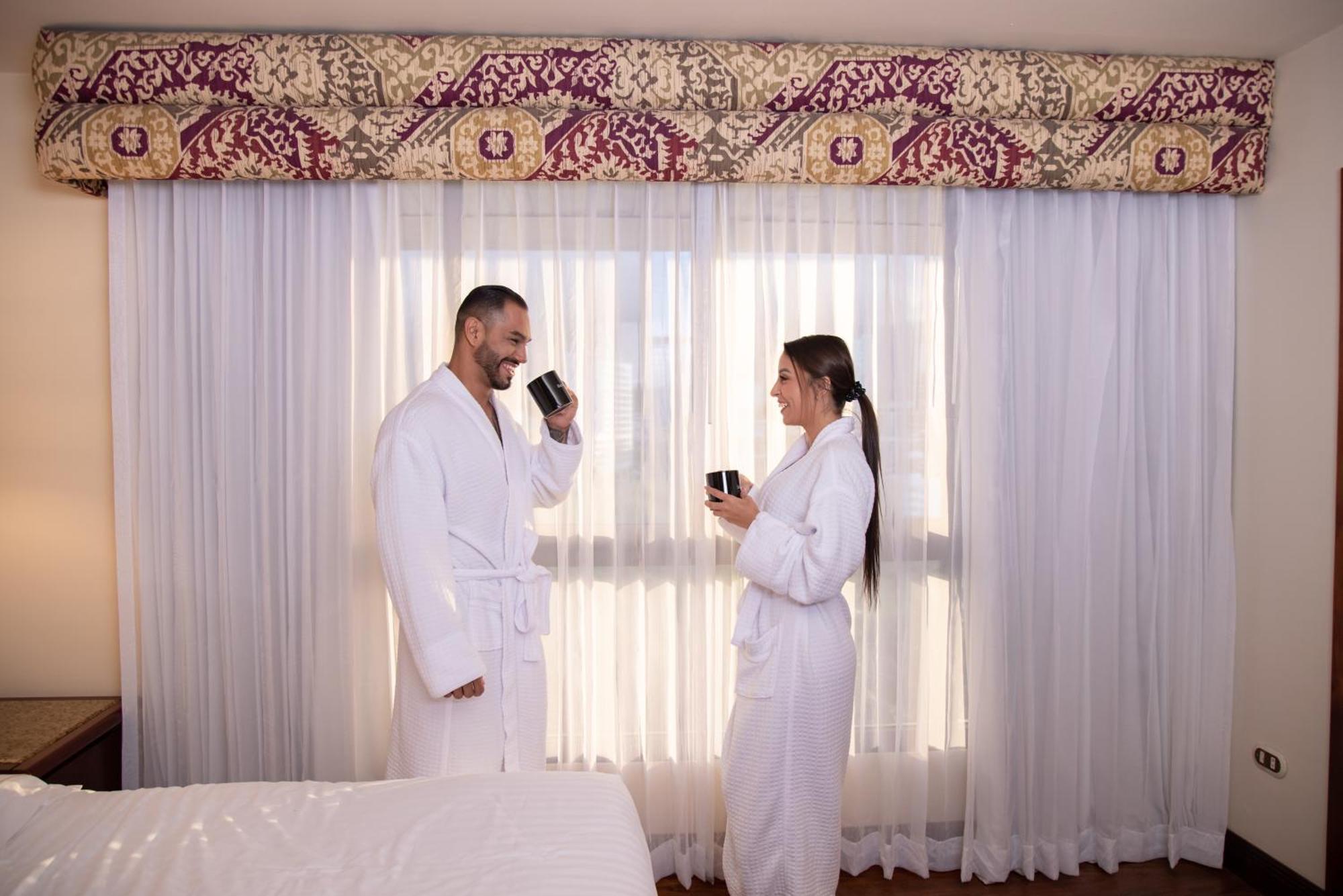 Barcelo San Jose Hotel Exterior photo A couple wearing bathrobes
