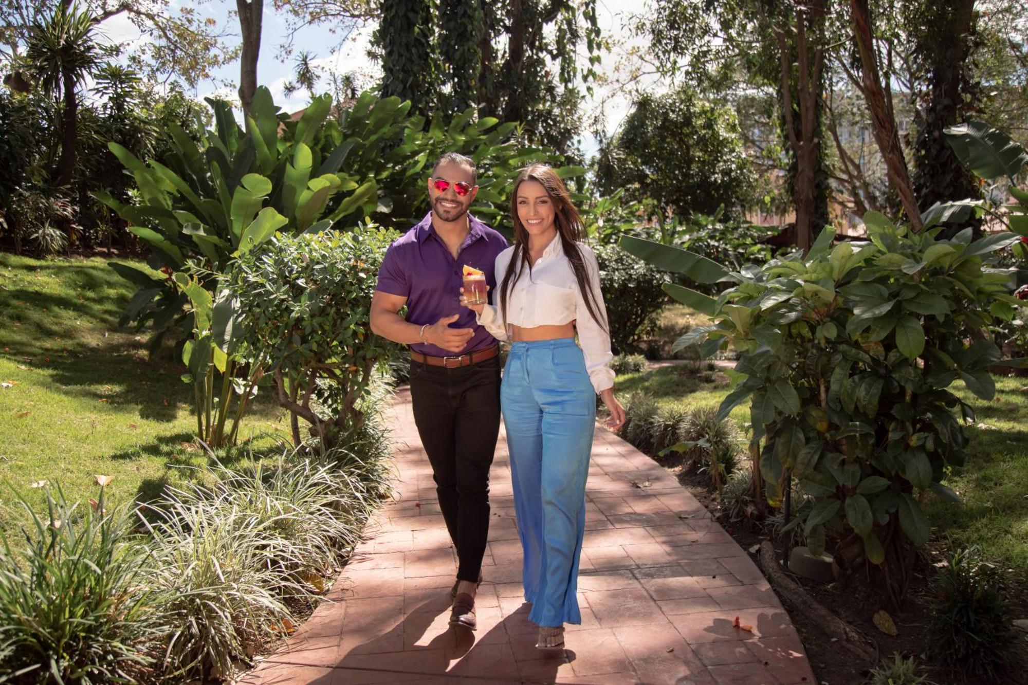 Barcelo San Jose Hotel Exterior photo A couple walking in the gardens of the hotel